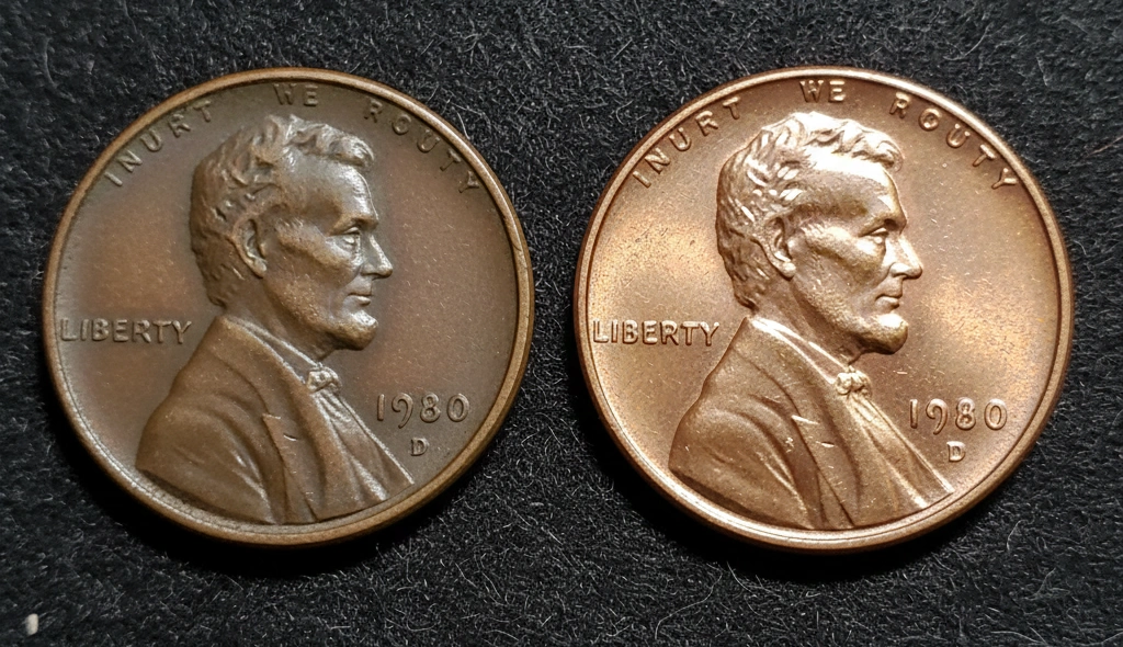 Close-up of worn vs mint-state 1980 penny side by side